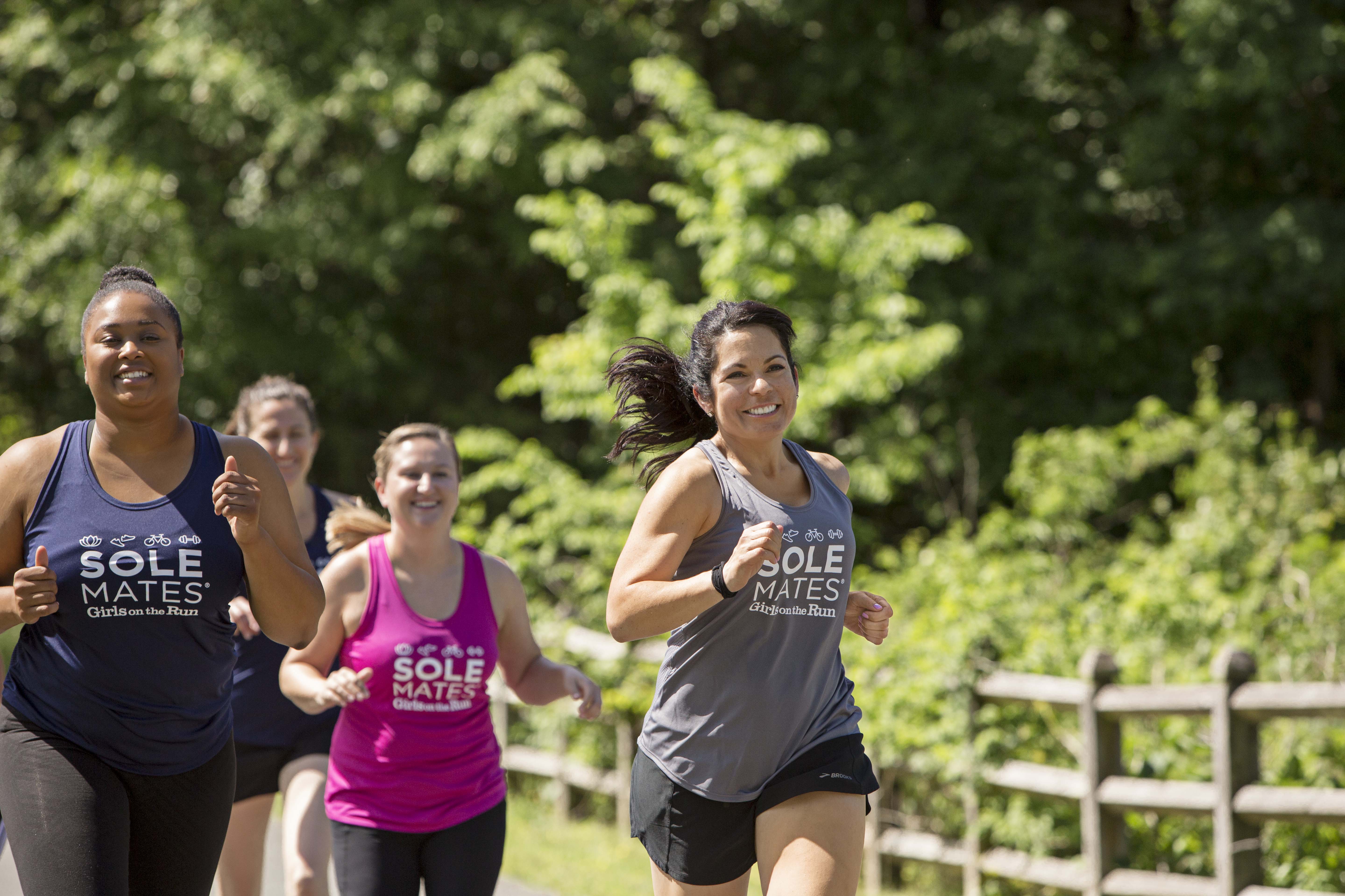 Group of SoleMates participants running 